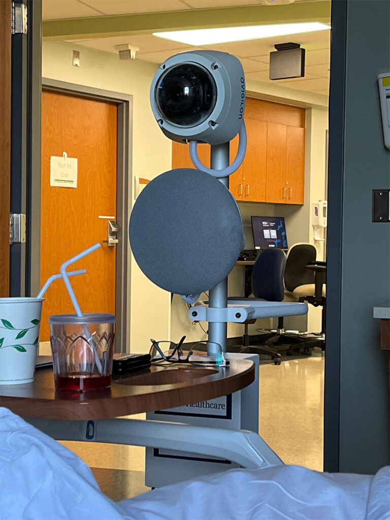 Phot to of robot nurse in a hospital room.
